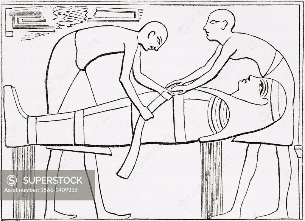 Ancient Egyptians swathing or wrapping bandages round a mummy. From The Imperial Bible Dictionary, published 1889.