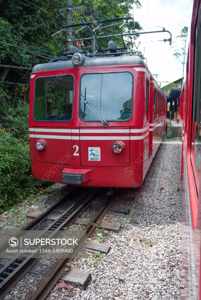 "Rio de Janeiro, Brazil: The famous train """"Trem do Corcovado"""" travelling up to the mountain top of Corcovado with it´s christ statue Cristo Rede...