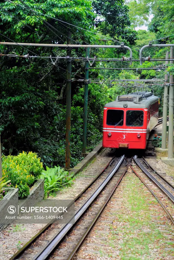 "Rio de Janeiro, Brazil: Famous train """"Trem do Corcovado"""" travelling up to the mountain top of Corcovado with it´s christ statue Cristo Redentor...
