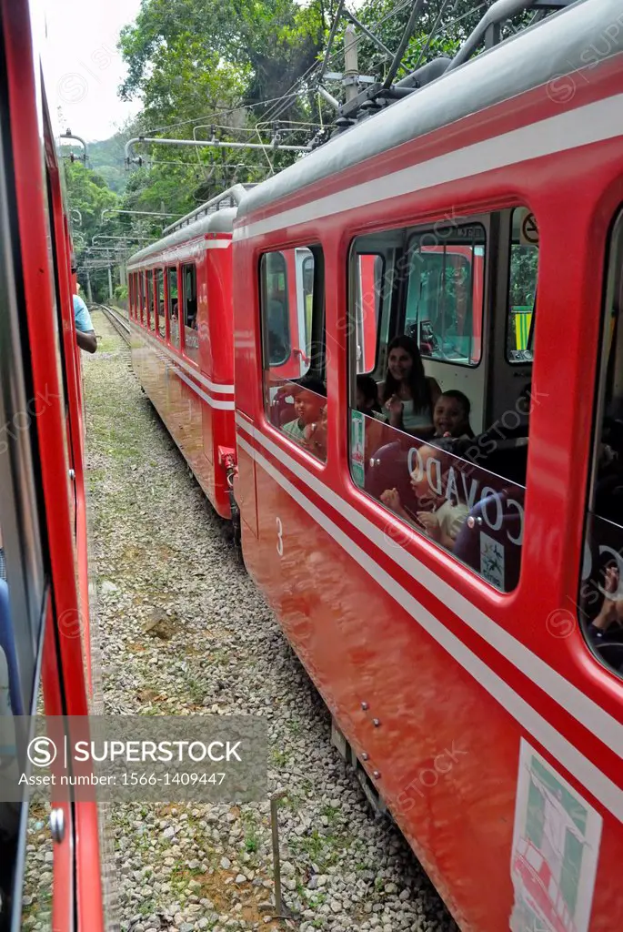 "Rio de Janeiro, Brazil: Famous train """"Trem do Corcovado"""" travelling up to the mountain top of Corcovado with it´s christ statue Cristo Redentor...