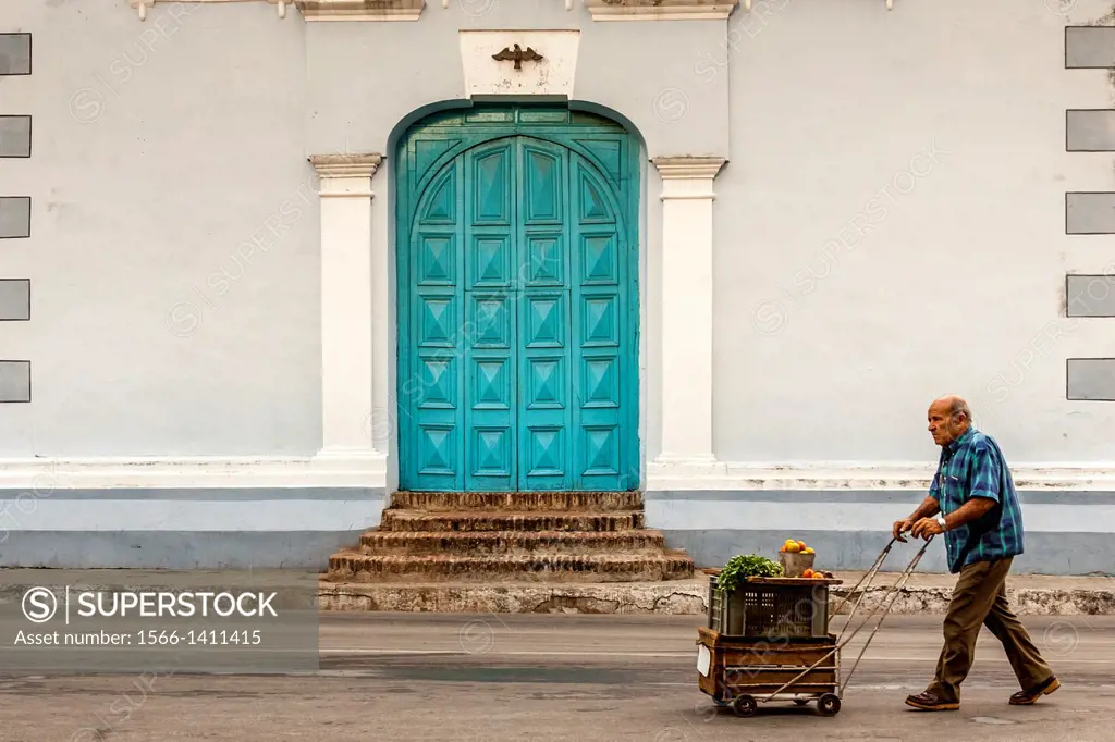A Cuban Man Pushes A Trolley of Fruit To Market, Sancti Spiritus, Cuba.