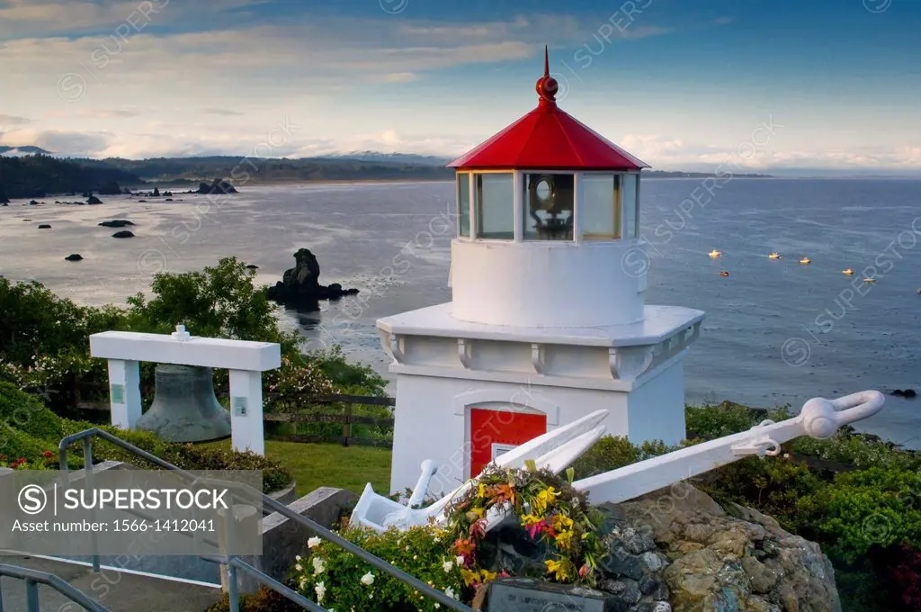 Trinidad Memorial Lighhouse overlooking fishing boats anchored in the ocean, Trinidad, California.