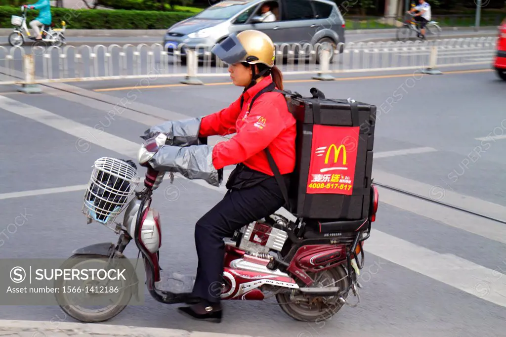 China, Beijing, Guang An Men Nei Da Jie, Guanganmen Outer Street, Asian, woman, employee, delivery, helmet, electric motor scooter, McDonald´s, restau...