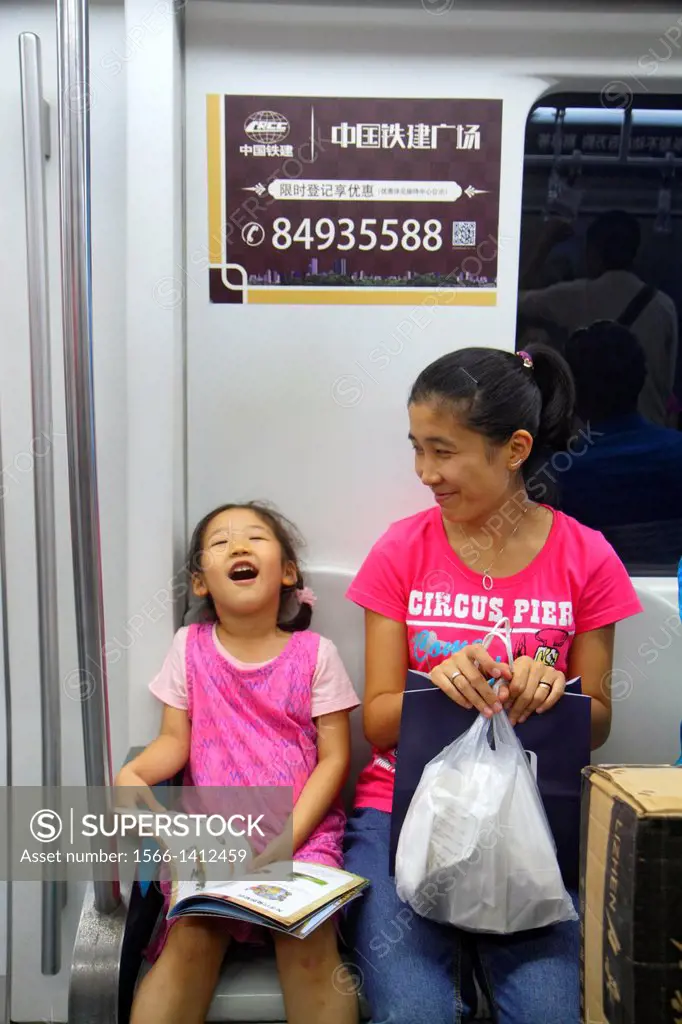 China, Beijing, Dongzhimen Subway Station, Line 2 13, public transportation, passengers, riders, train cabin, Asian, woman, mother, girl, daughter, Ch...