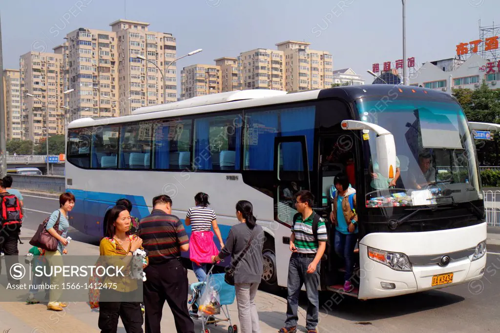 China, Beijing, Chaoyang District, Panjiayuan, motor coach, bus, Asian, man, woman, exiting,.