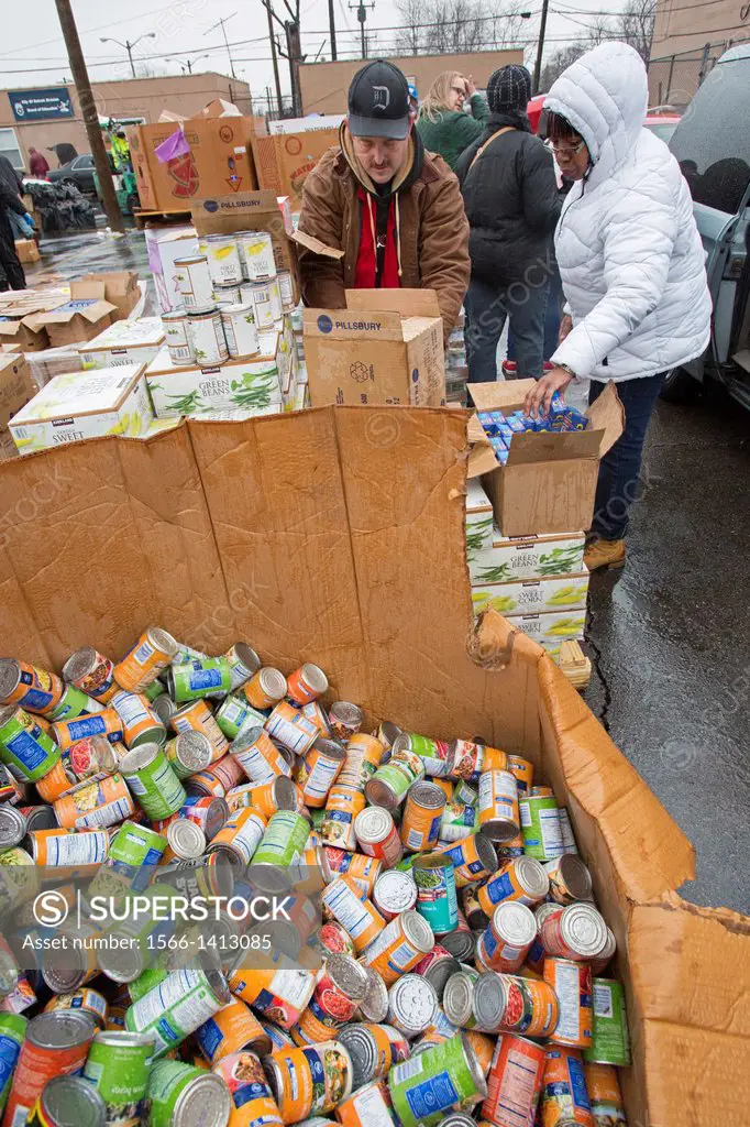 Detroit, Michigan - In a cold rain, volunteers from local trade unions packed holiday food boxes for the less fortunate. The annual event distributes ...