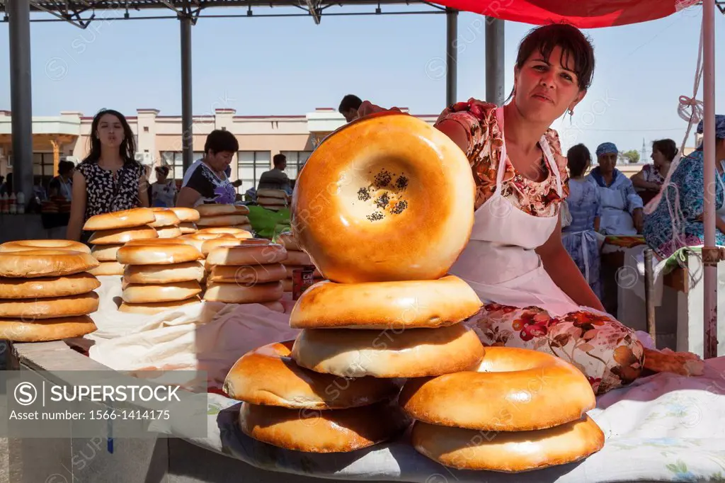 Woman selling non bread, Siyob Market, also known as Siab Market, Samarkand, Uzbekistan.