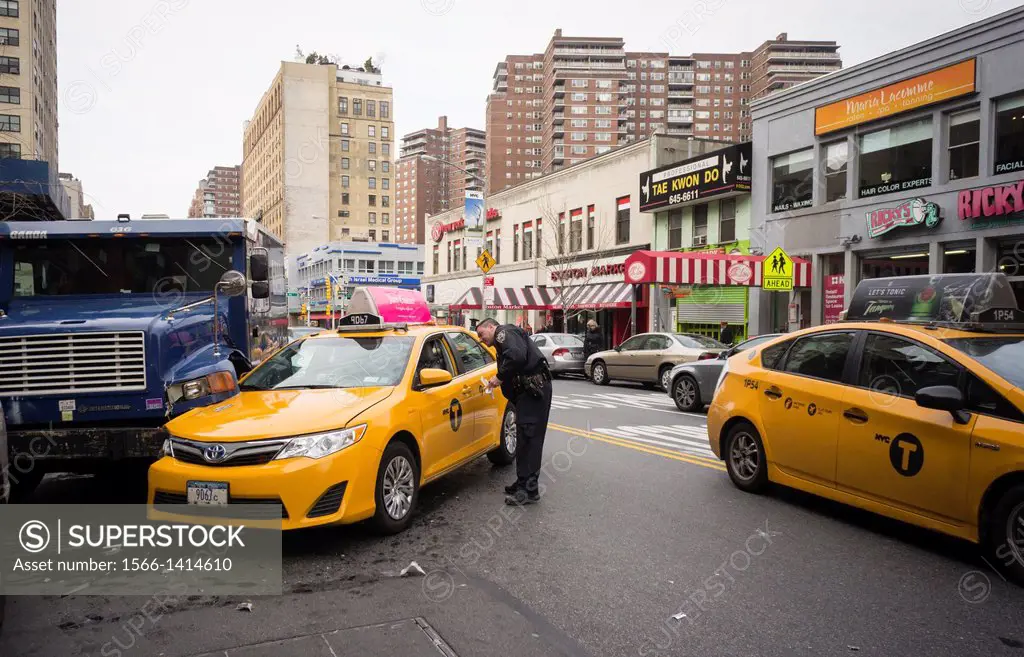 Taxi and armored car meet by accident in the Chelsea neighborhood of New York