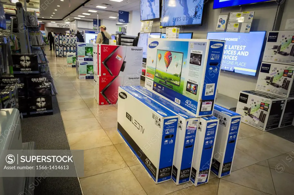Flat-screen televisions on sale in a Best Buy electronics store in New York over the Black Friday weekend. Retailers saw a 2.3 gain in sales over Than...