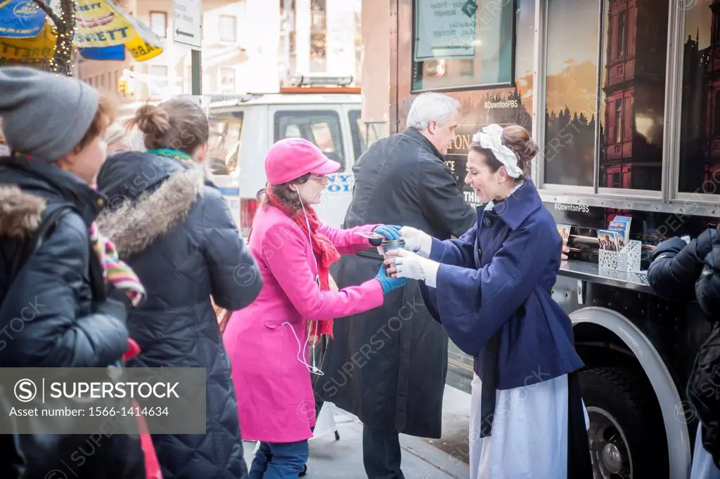Actors in servants´ costumes serve tea and biscuits to passer-by at Masterpiece´s Downton Abbey truck in midtown in New York. Season Four of the popul...