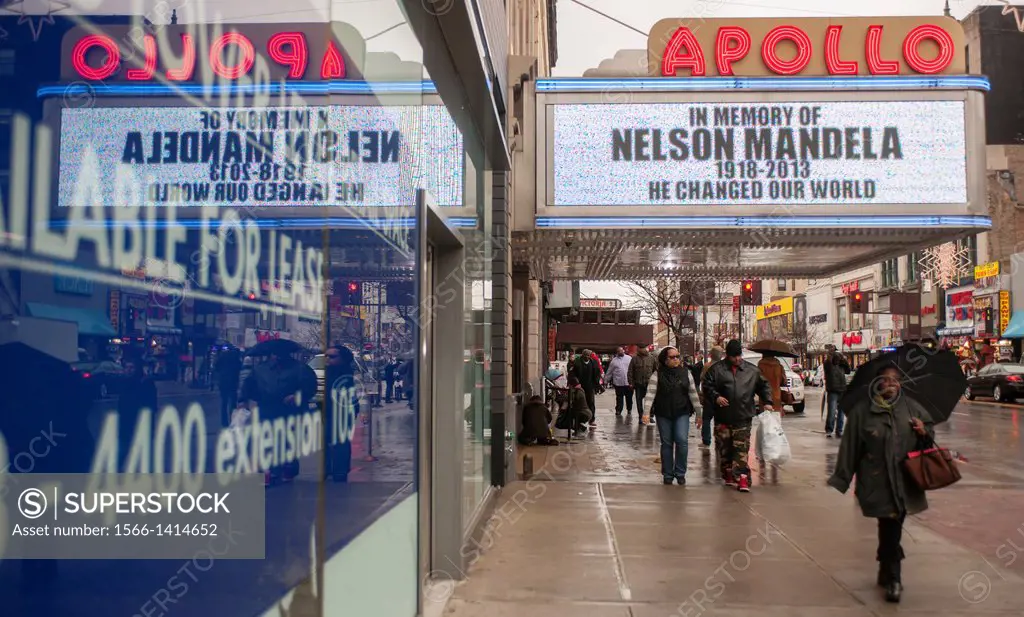 The marquee of the Apollo Theater in Harlem in New York on a rainy Friday, December 6, 2013 shows a memorial to the late Nelson Mandela. The South Afr...