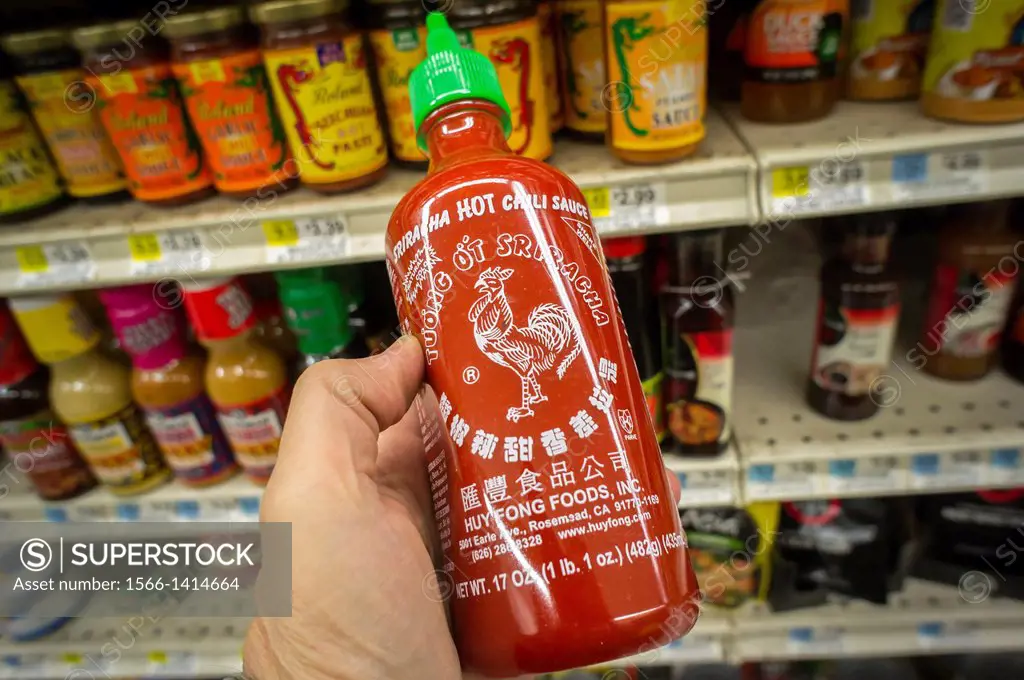 A bottle of Sriracha hot sauce manufactured by Huy Fong Foods is seen in the asian food section of a supermarket in New York. The Rosemead, CA food ma...