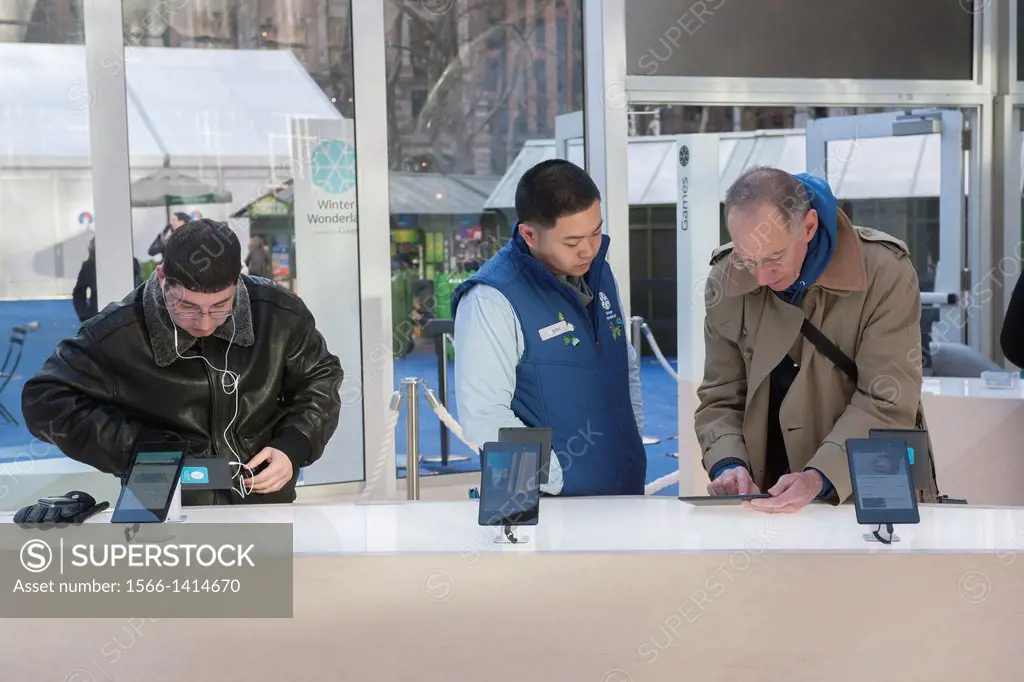 Visitors to Google´s Winter Wonderlab pop-up in Bryant Park in New York. The minimalist store, one of six Google has set up around the country to hawk...