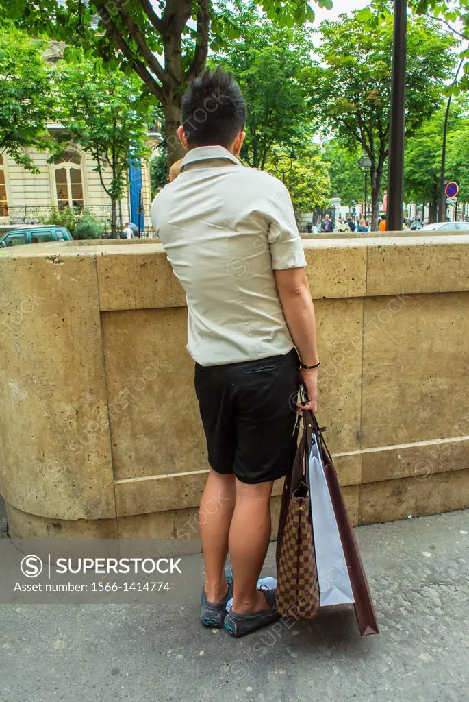 Paris, France, Chinese Tourist with Shopping Bags, Shopping on the Avenue Montaigne
