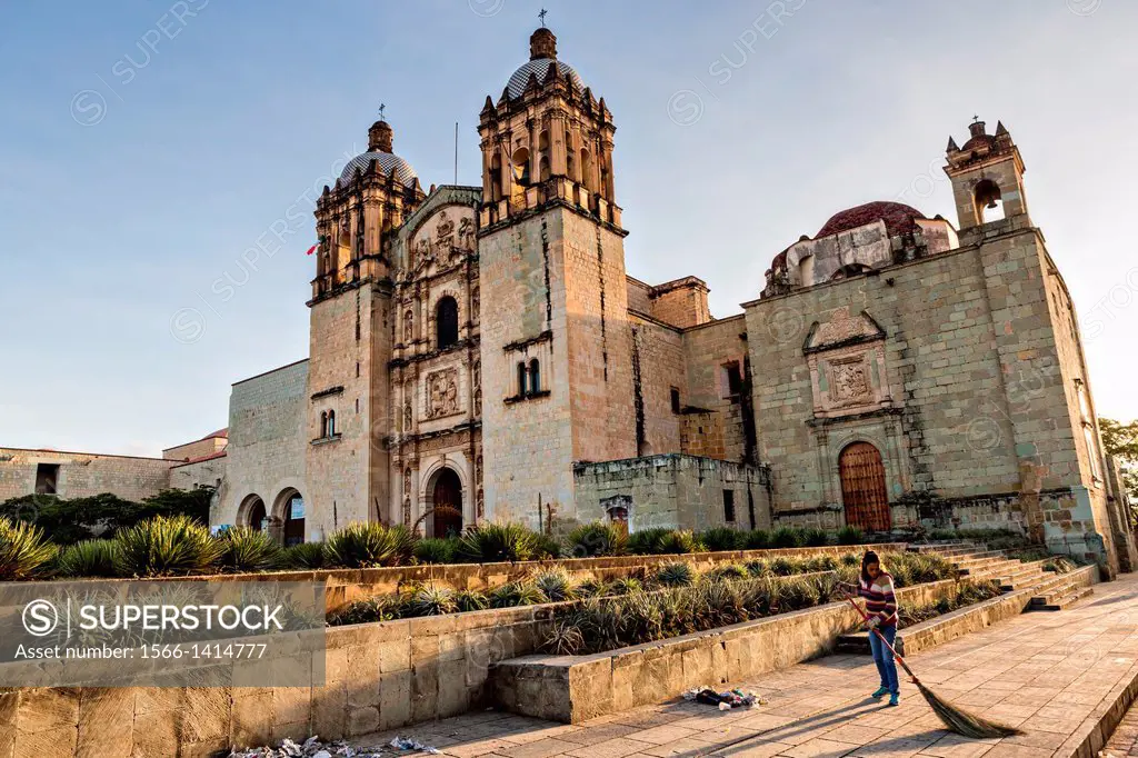 Church of Santo Domingo de Guzmán in the historic district with a street sweeper cleaning the plaza October 30, 2013 in Oaxaca, Mexico.