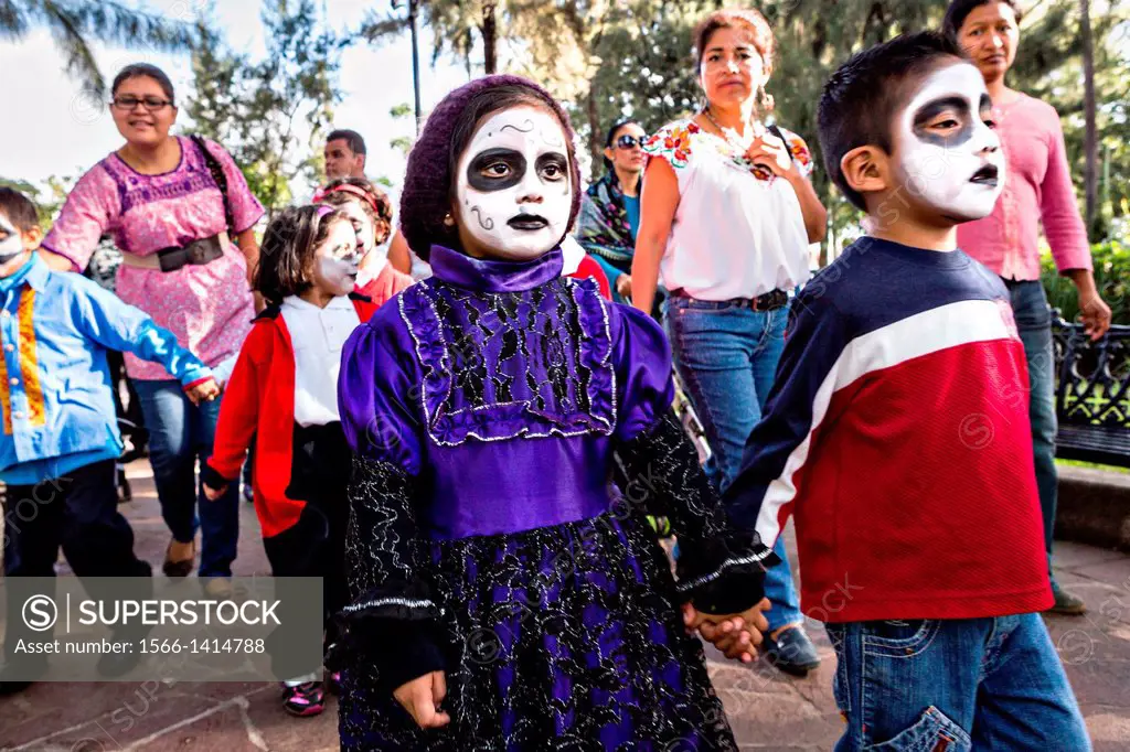 Costumed children take part in Day of the Dead festival known in spanish as Día de Muertos in Oaxaca, Mexico.