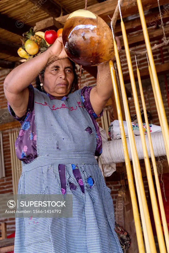 A Zapotec indigenous woman hand makes beeswax candles for the Day of the Dead festival known in spanish as Día de Muertos October 30, 2013 in Teotitla...