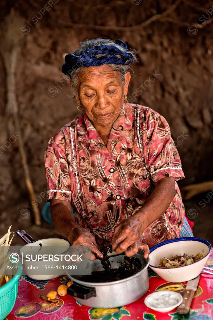 An elderly Zapotec indigenous woman hand makes traditional tamales for use in the Day of the Dead festival known in spanish as Día de Muertos October ...