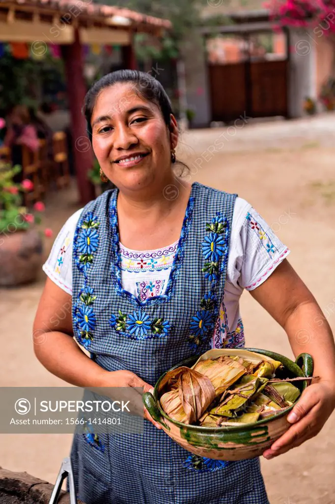 Reyna Mendoza Ruíz of El Sabor Zapoteco Cooking School hand makes traditional tamales for use in the Day of the Dead festival known in spanish as Día ...
