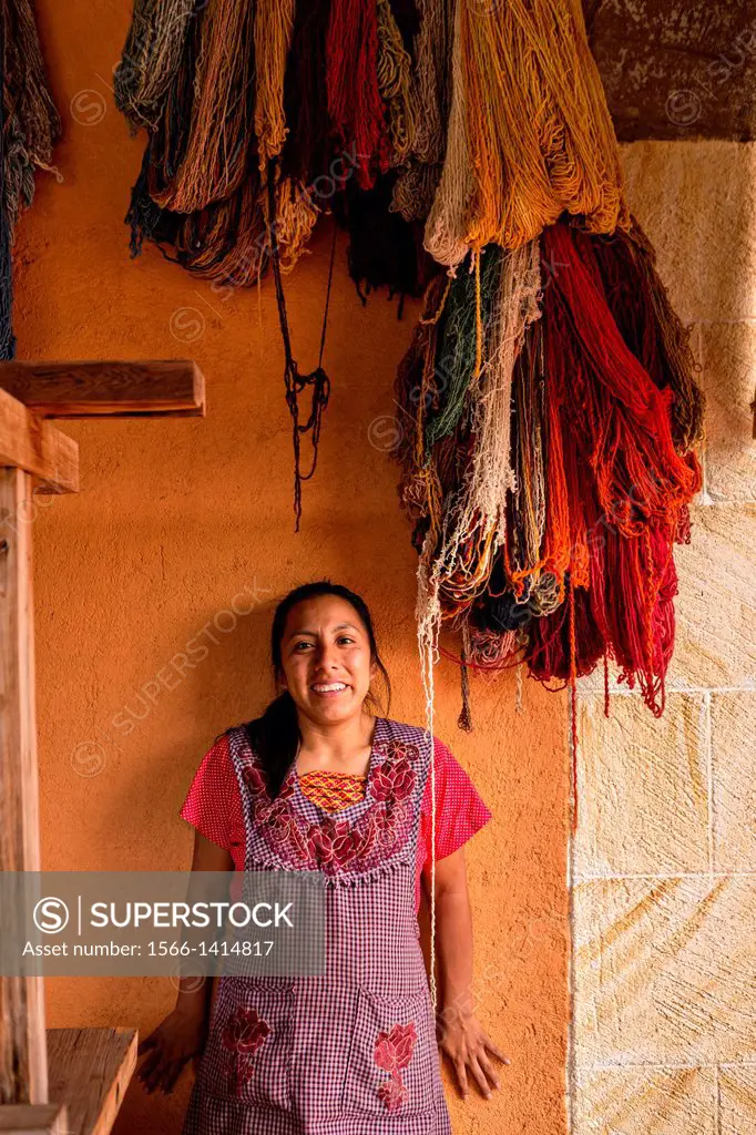 A Zapotec indigenous woman by hand dyed wool used to weave traditional carpets October 30, 2013 in Teotitlan de Valle, Mexico.