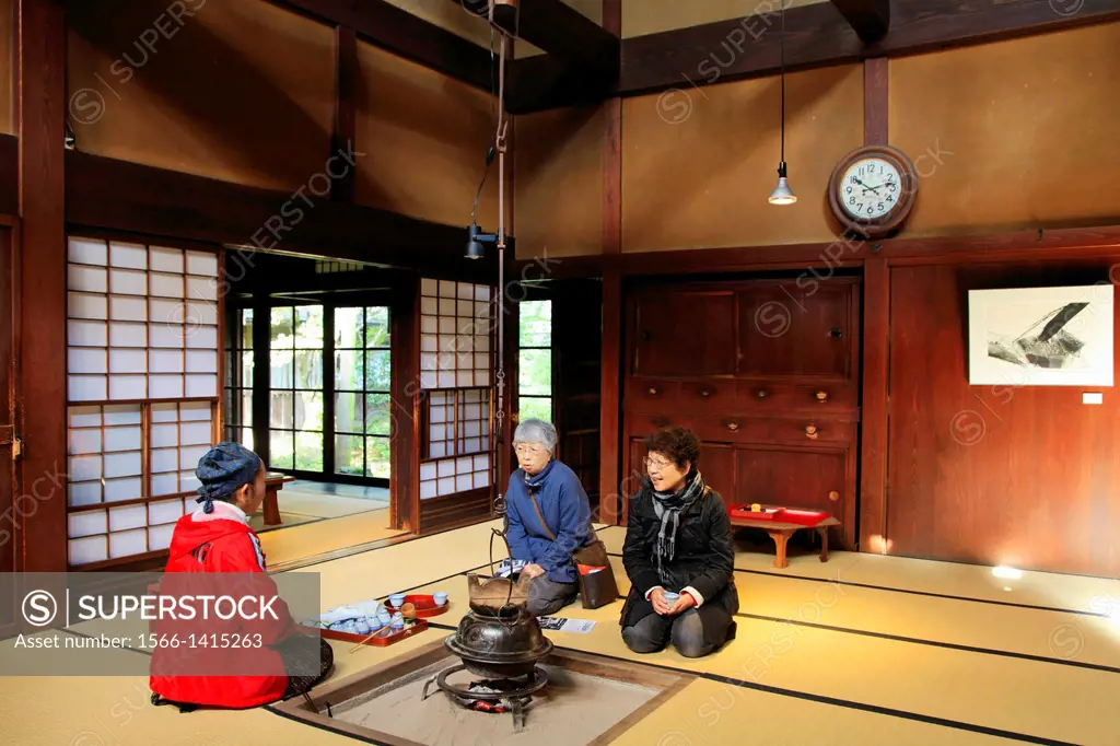 Japan, Hida, Takayama, Kusakabe Heritage House, interior, women drinking tea,.