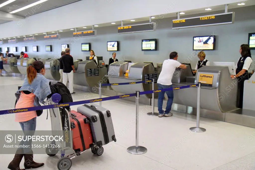 Florida, Miami, Miami International Airport, MIA, terminal, ticket counter, check in, Hispanic, woman, luggage, cart, Lufthansa,.