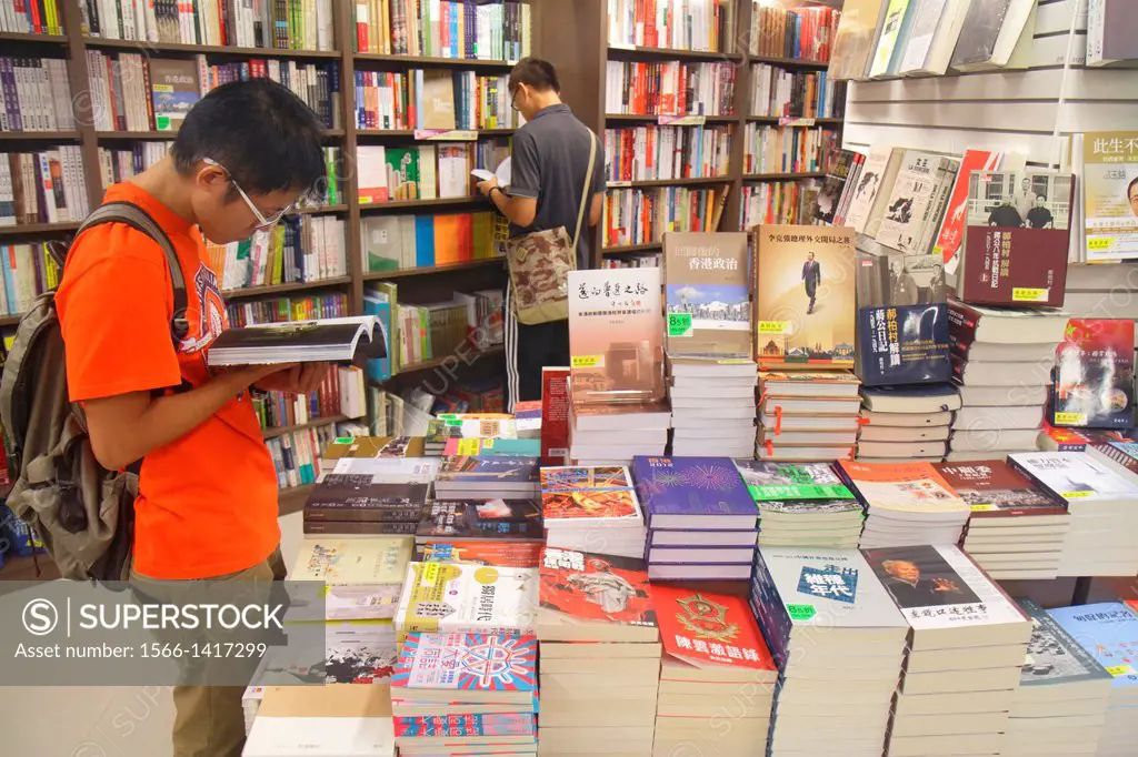 China, Hong Kong, Island, Causeway Bay, Yee Wo Street, bookstore, books, sale, display, customer, browsing, Asian, man,.