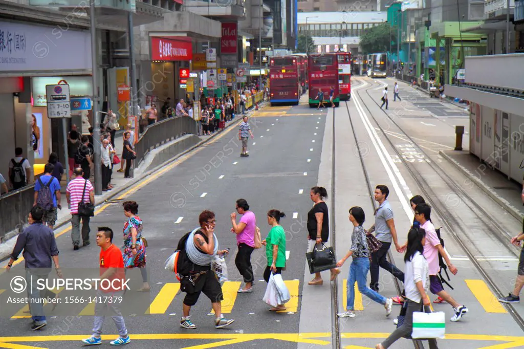 China, Hong Kong, Island, Central, Des Voeux Road Central, pedestrians, crossing street, tracks, Asian, man, woman,.
