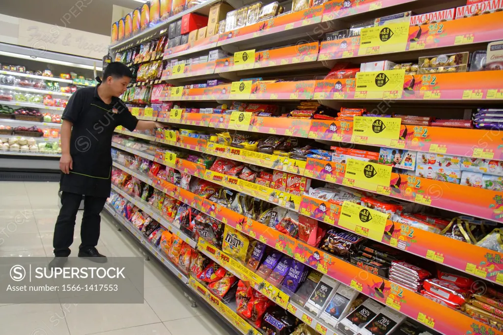 China, Hong Kong, North Point, Java Road, Wellcome Supermarket, grocery store, food, sale, display, shopping, candy, shelves, Asian, man, employee, wo...