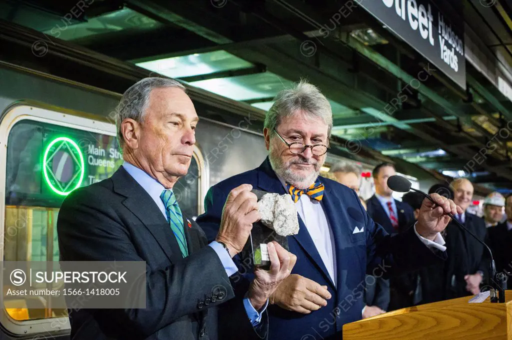 NYC Mayor Michael Bloomberg, left, receives a chunk of the tunnel from President of the MTA Capital Construction Corporation, Mike Horodniceanu, right...