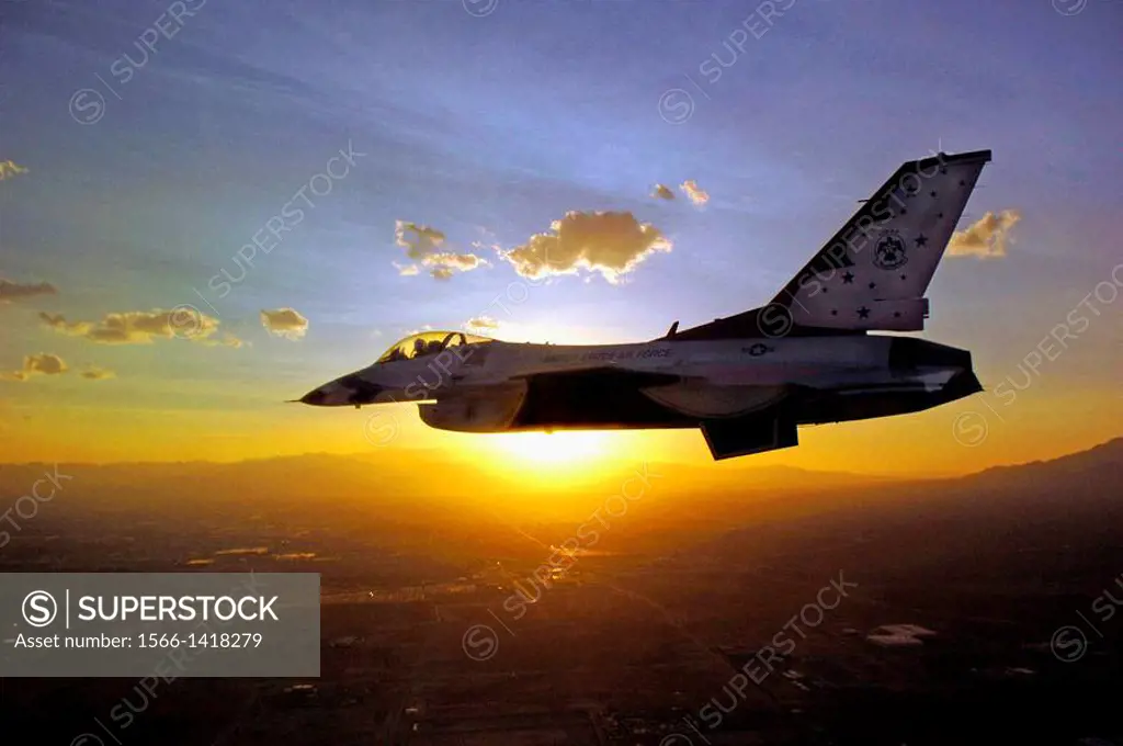 A lone F-16 Fighting Falcon from the U  S  Air Force Thunderbirds flies against the sunrise. The demonstration squadron has recently released its 2009...