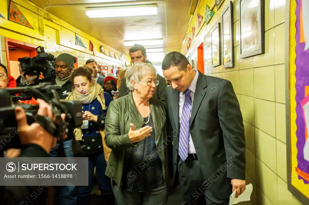 NYC Dept. of Education Chancellor Carmen Fariña, left, speaks with Principal Dr. Ramon Gonzalez during her visit to MS 223, The Laboratory School of F...
