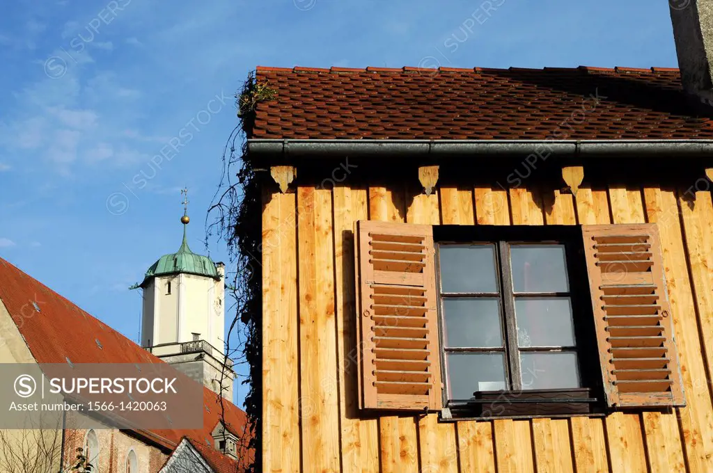Old wooden house in front of the Saint Martin church in Memmingen / Bavaria