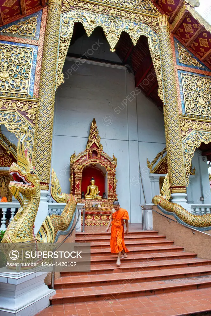 Monk walking at Wat Chedi Luang temple, Chiang Mai, Thailand.