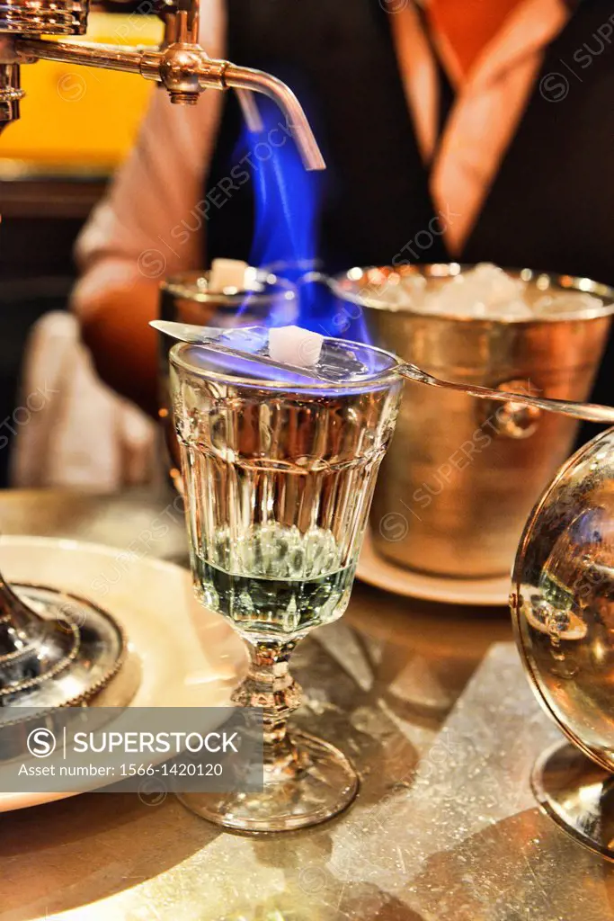 pouring absinthe the traditional way, Bangkok, Thailand.