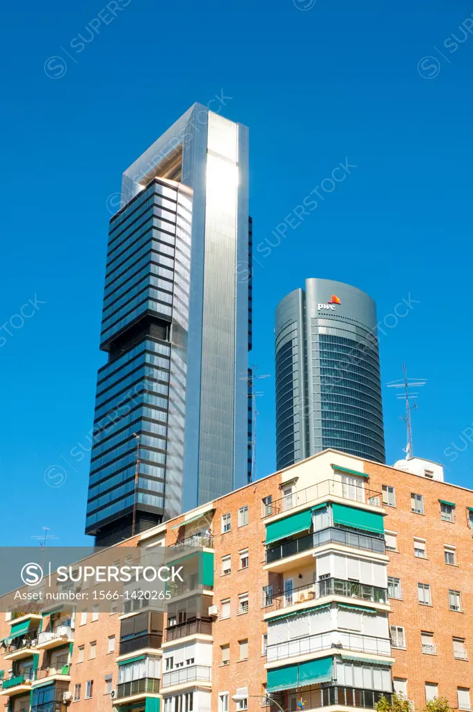Two of the Four Towers contrasting with tenements. Madrid, Spain.
