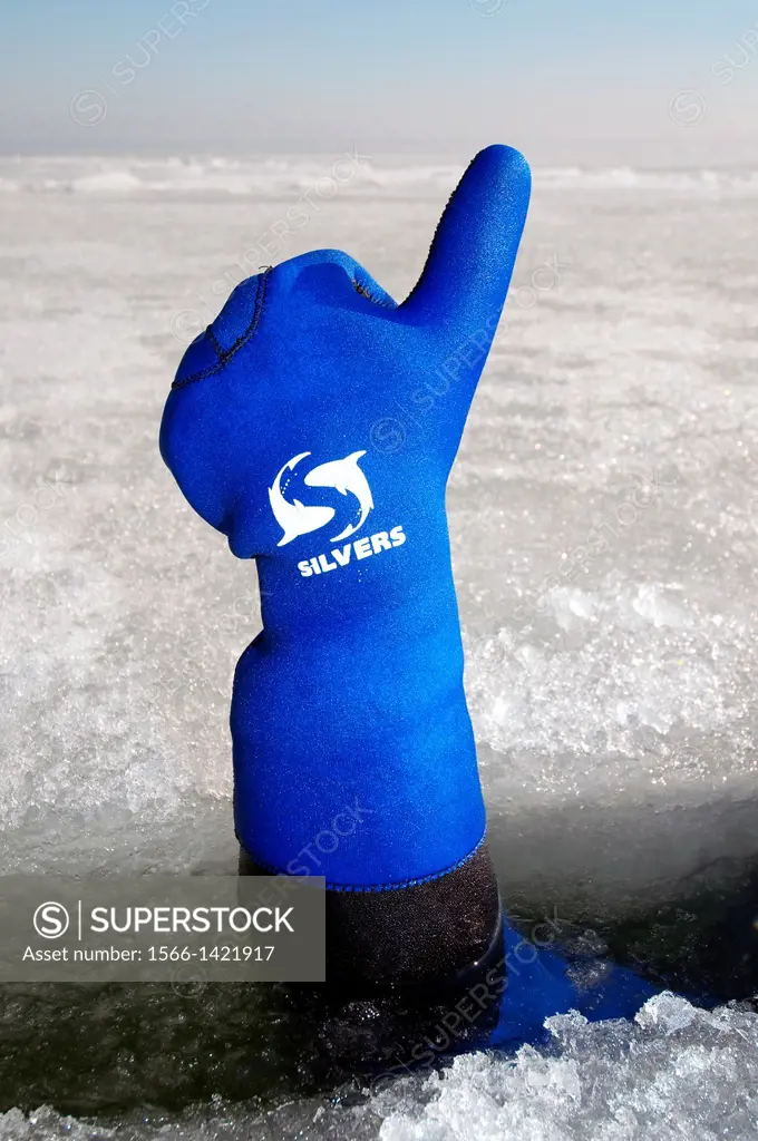 Diver´s hand giving the Upwards sign, subglacial diving, ice diving, in the frozen Black Sea, a rare phenomenon, last time it occured in 1977, Odessa,...