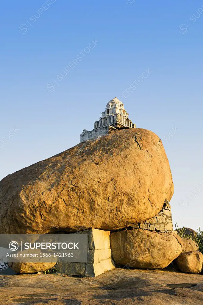 Small hanuman shrine on a boulder at sunset point at Hampi, Karnataka. World heritage site India