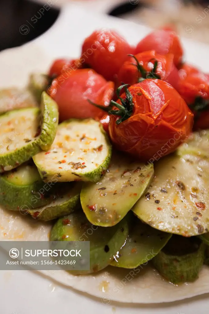 Still-life photo of grilled tomatoes and grilled zucchini, Istanbul, Marmara Province, Turkey, Europe.