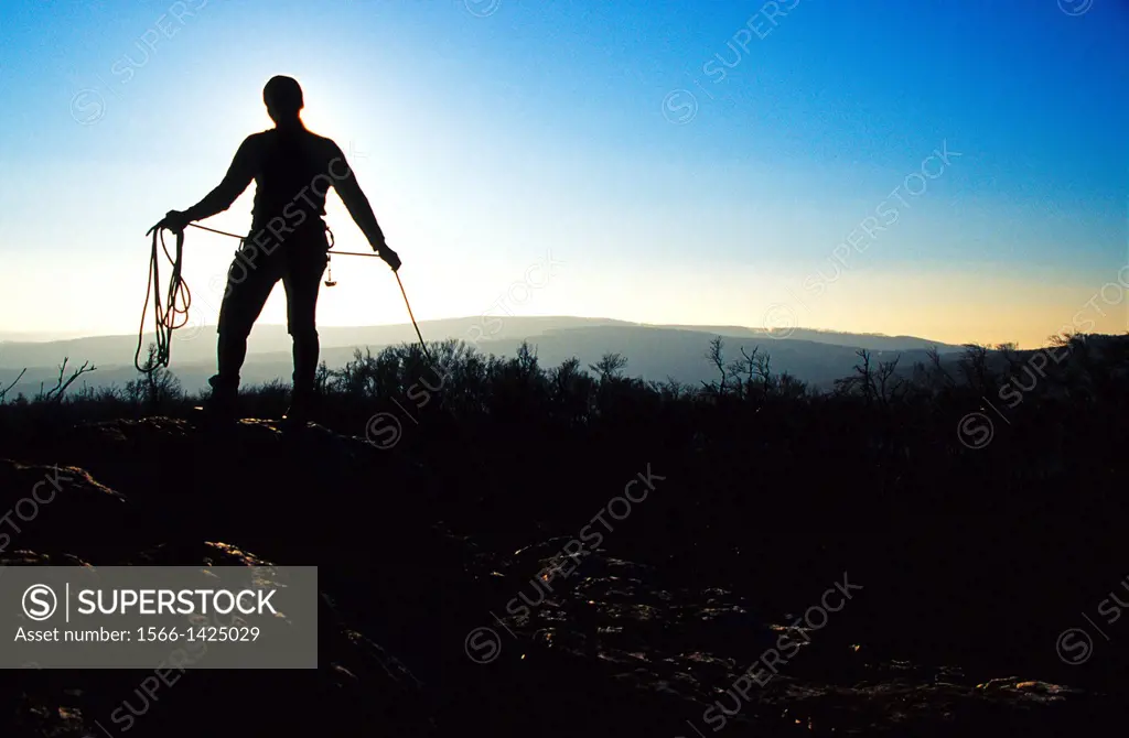 The silhouette of a climber packing his rope, Male Karpaty, Slovakia.