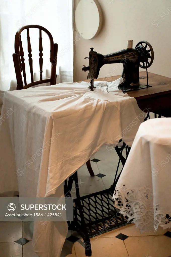 Sewing machine with linen, Interior of Casa Mila, Barcelona, Catalonia, Spain.
