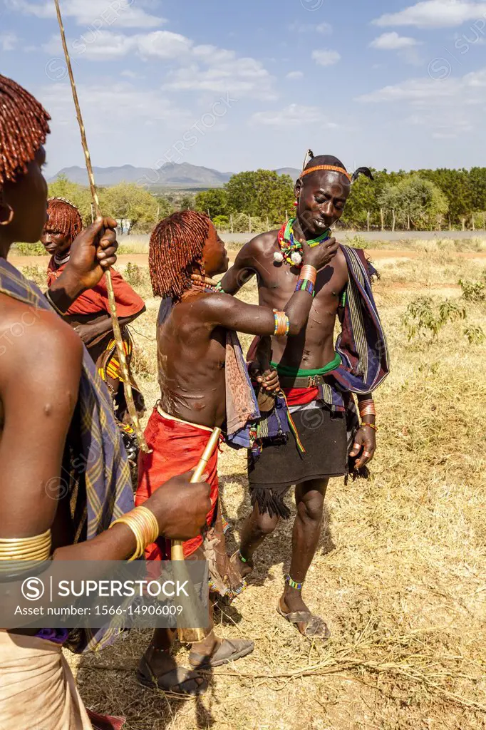 Young Hamar Women Taunt A Hamar Tribesman In To Whipping Them. The