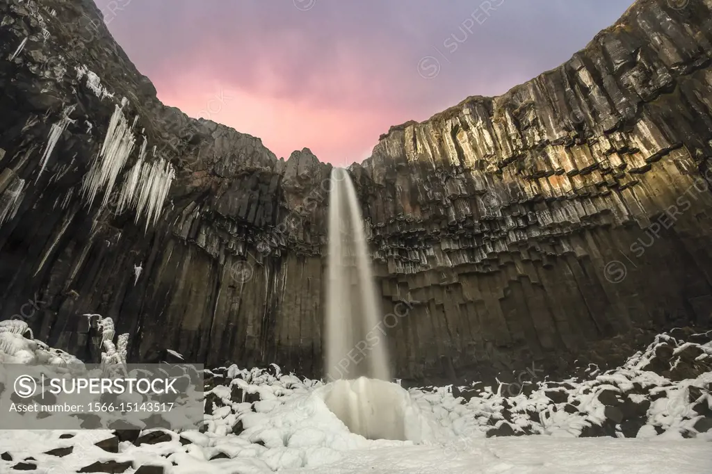 Svartifoss waterfall at sunset, Skaftafell National Park, Southern Iceland.