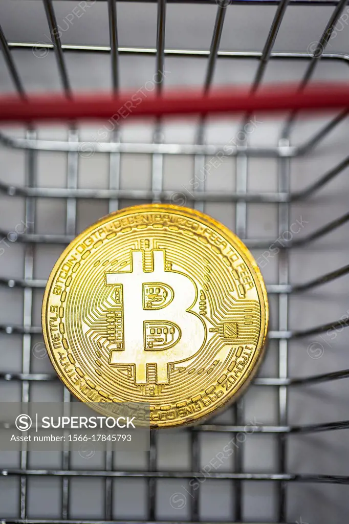 Gold Bitcoin is a cryptocurrency and worldwide payment, Bitcoin, Ethereum, Litecoin in iron shopping basket, Virtual money concept. close up business ...