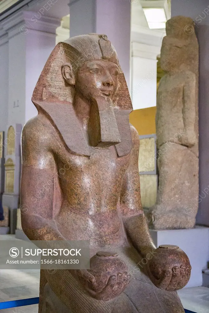 Cairo, Egyptian Museum, kneeling statue of Hatshepsut, one of the rare women who became king of Egypt. Granite, from her temple in Deir el Bahari. She...