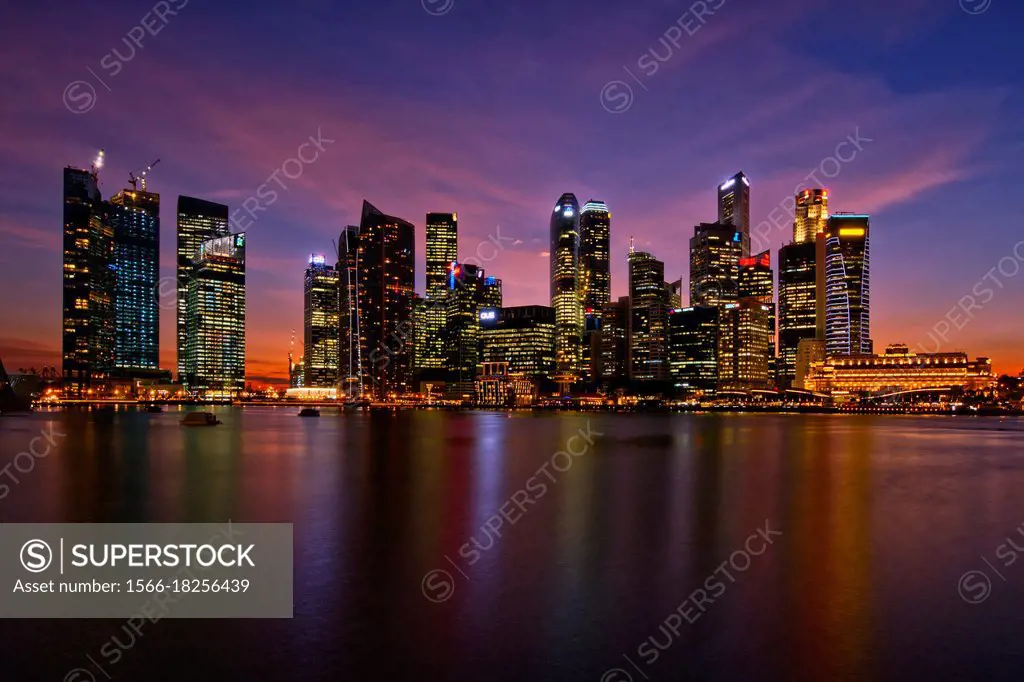 A view of the Singapore Central Business District and skyline at dusk, viewed from the Marina Bay Sands integrated resort