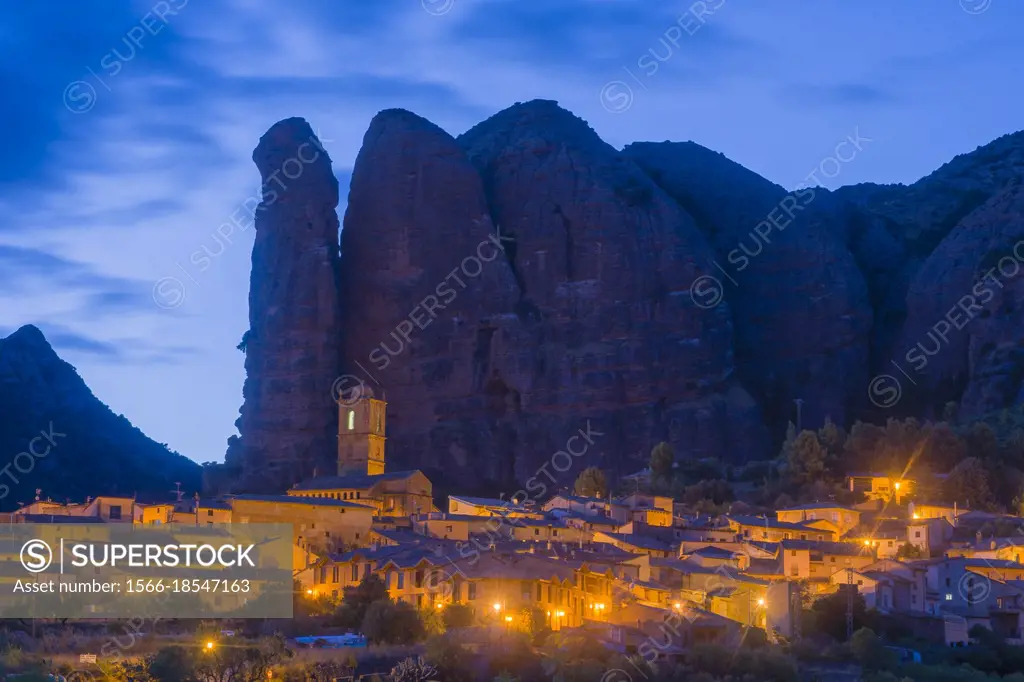 Landscape of the Mallos de Aguero by night famous geological formations with the town of Aguero in the province of Huesca Aragon, Spain.