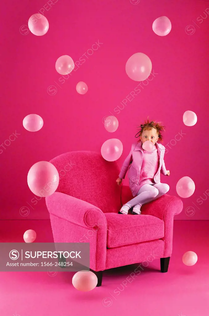 6 year old girl blowing bubbles