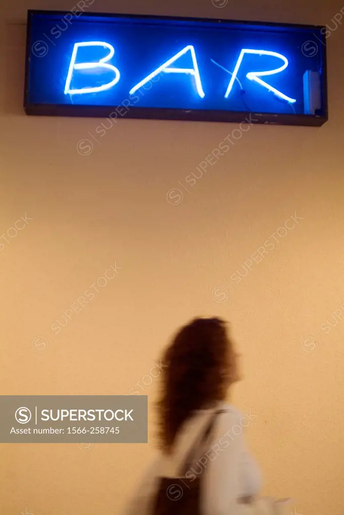 Bar sign and woman