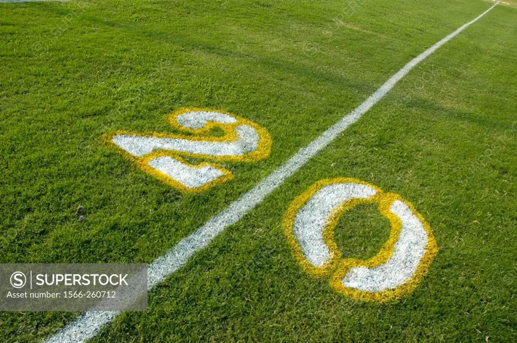 Painted yardage lines of football field, some being painted